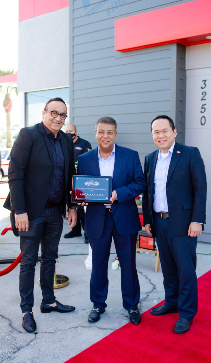 Amgad Attalla receiving the Charleys Highest Drive-Thru Average award, 2019